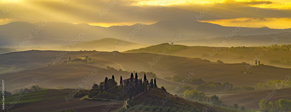 the famous Tuscan landscape at sunrise