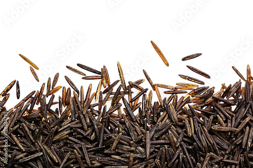 Картината върху платно Border of black rice close-up  on white background
