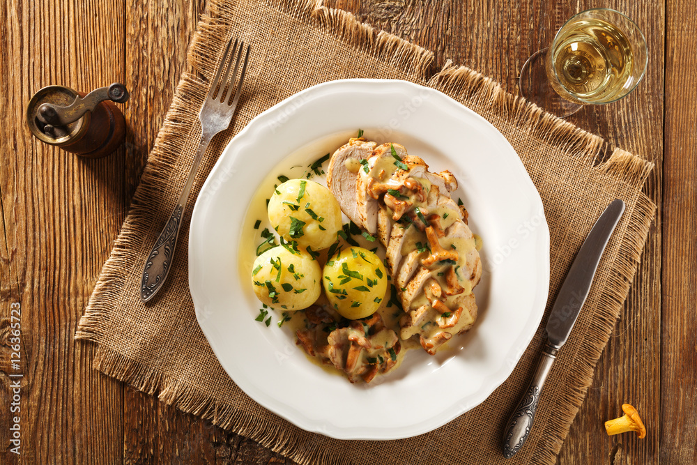 Roasted chicken breast served in a mushroom chanterelle sauce. Roasted chicken breast served in a mushroom chanterelle sauce.