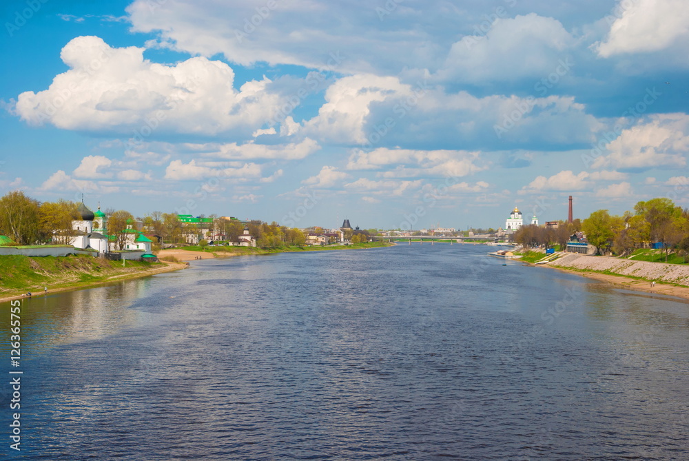 Pskov City landscape with Great-river and temples on banks of river