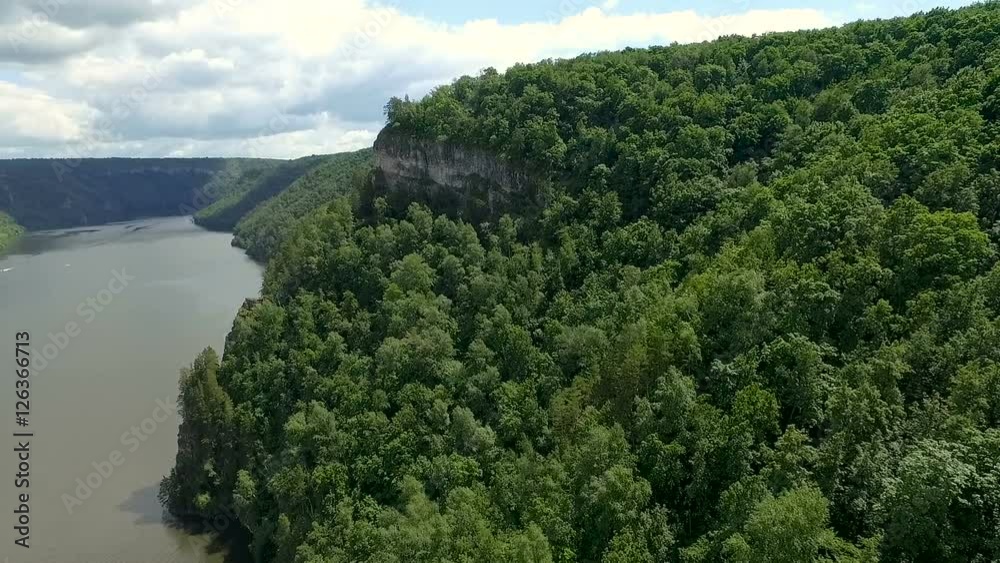 Aerial shot of a hawk flying over the mountain. Aerial shot of a hawk flying over the mountain.
