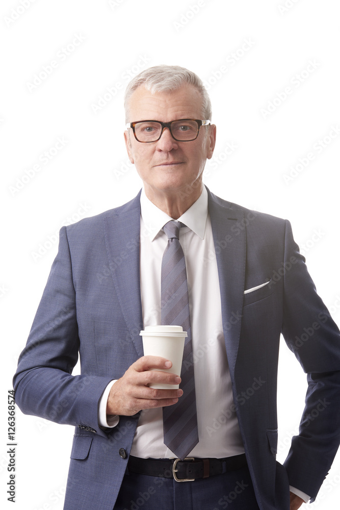 Old professional man. Shot of a senior businessman with a cup of coffee standing at isolated white background. Old professional man. Shot of a senior businessman with a cup of coffee standing at isolated white background.
