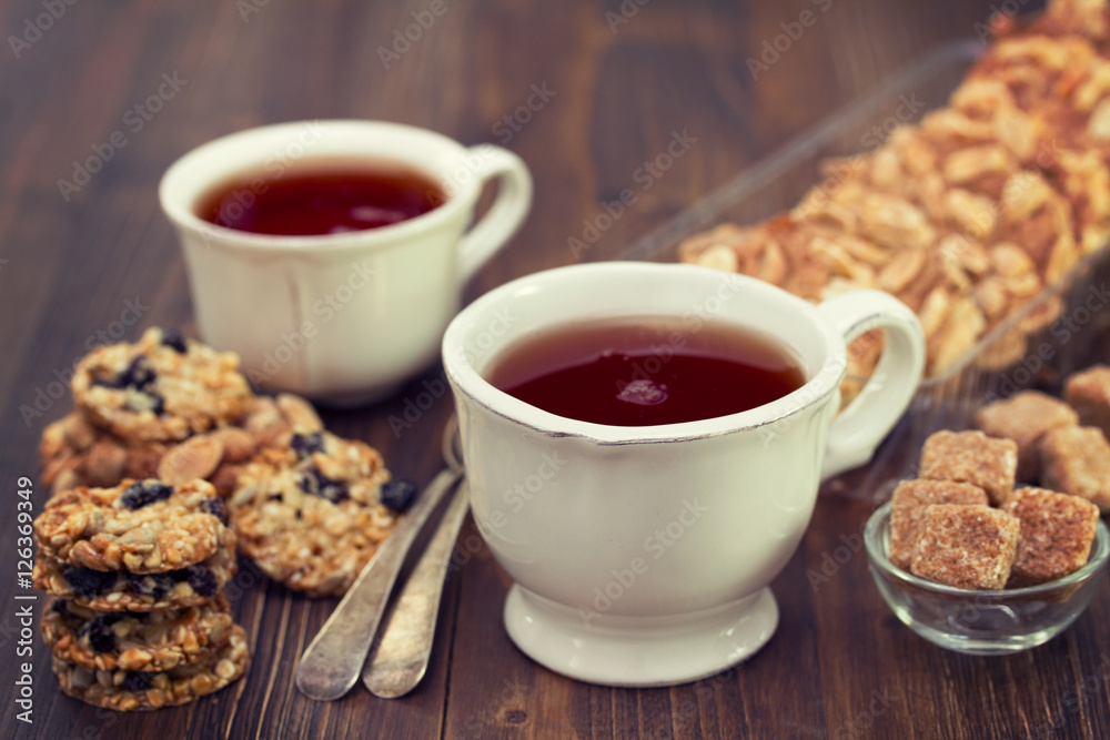 cup of tea with cookies on wooden background cup of tea with cookies on wooden background