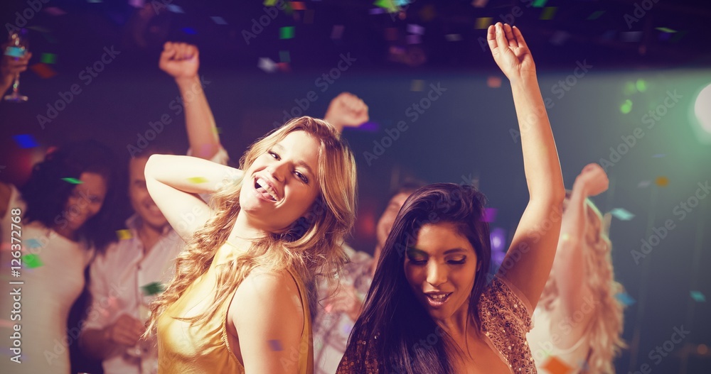 Composite image of friends holding champagne while dancing Composite image of friends holding champagne while dancing