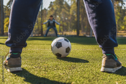 Father playing football with son