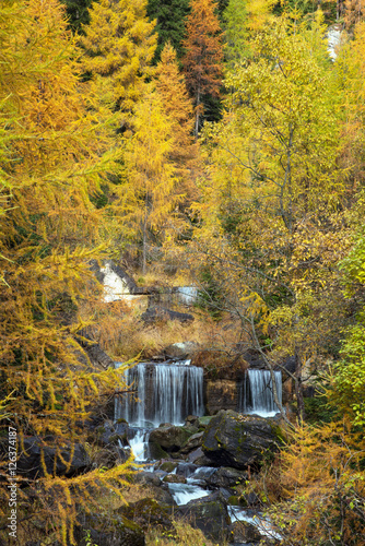 Incredible autumn landscape with waterfalls in the forest in Dol