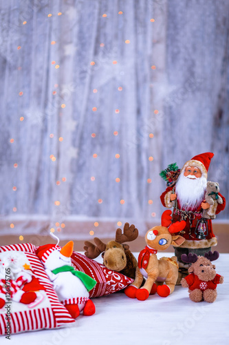 Christmas still life decorations with fluffy toy animals and Santa