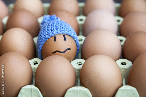 Unhappy in winter concept presented with egg character. Other possible concepts are: In troble, lost, problems, etc...