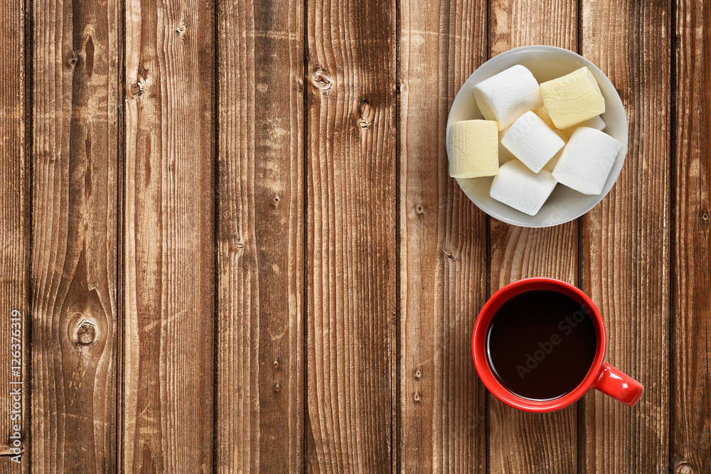 Marshmallow and coffee cup on wooden table top view Marshmallow and coffee cup on wooden table top view