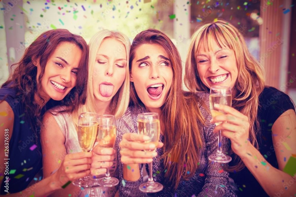 Composite image of beautiful women making funny faces Composite image of beautiful women making funny faces