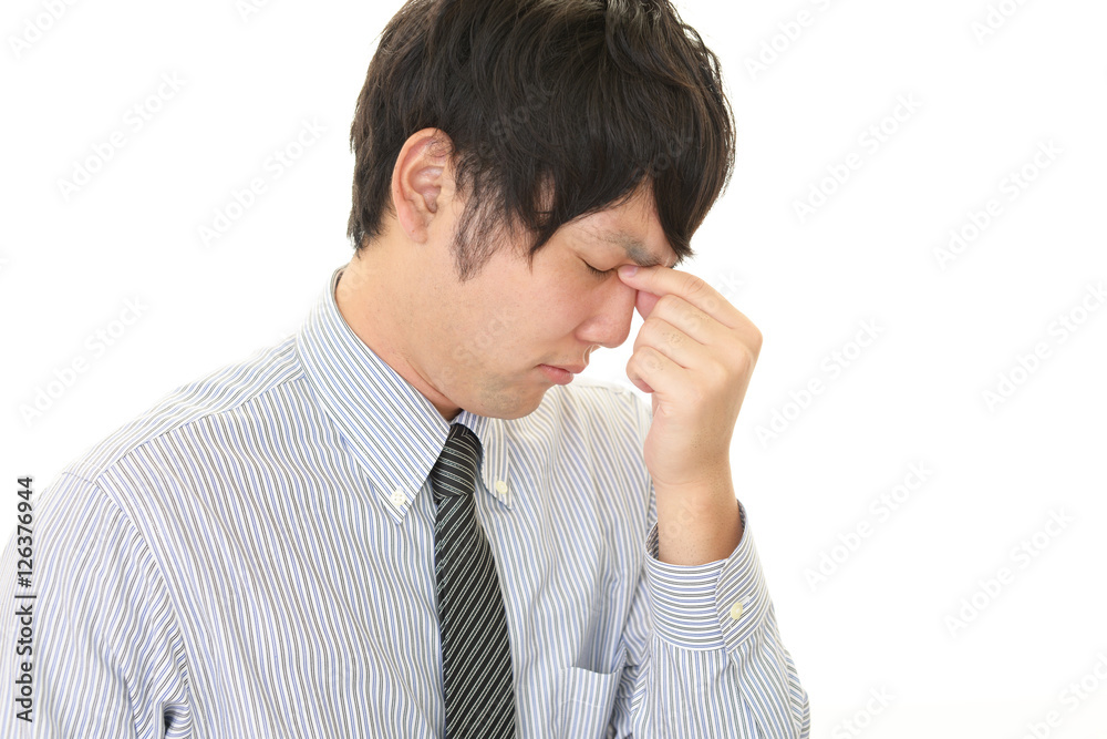頭痛を訴えるビジネスマン