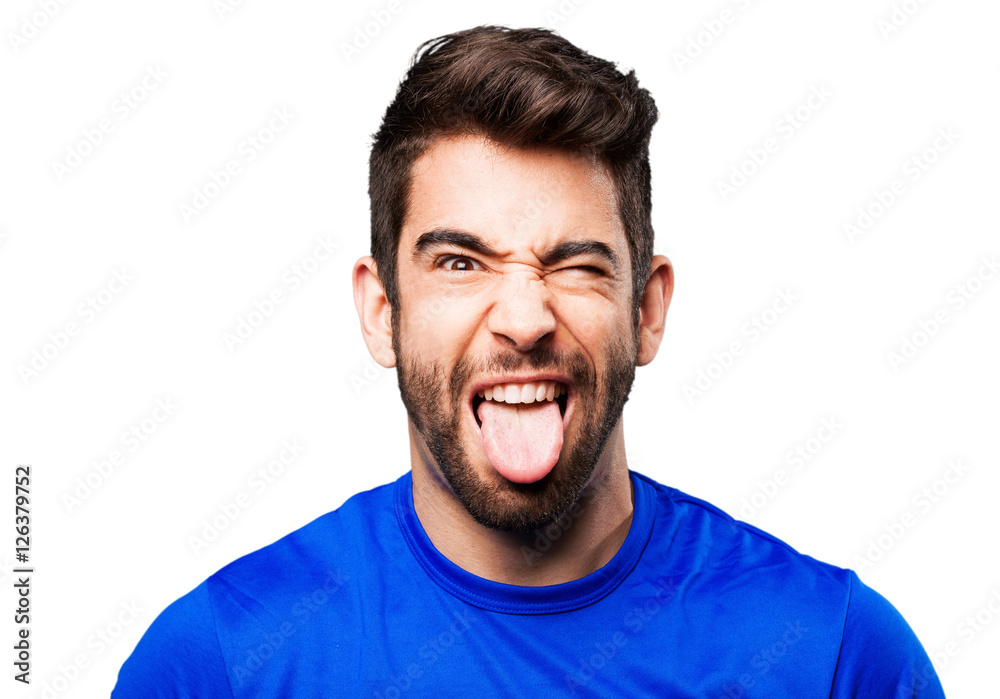 young man showing tongue
