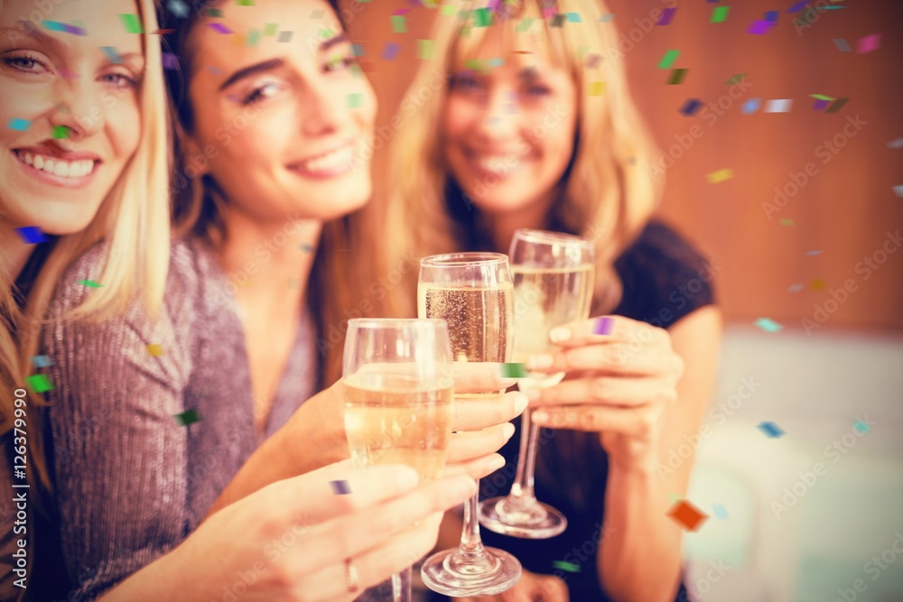 Composite image of portrait of beautiful women holding drinks Composite image of portrait of beautiful women holding drinks
