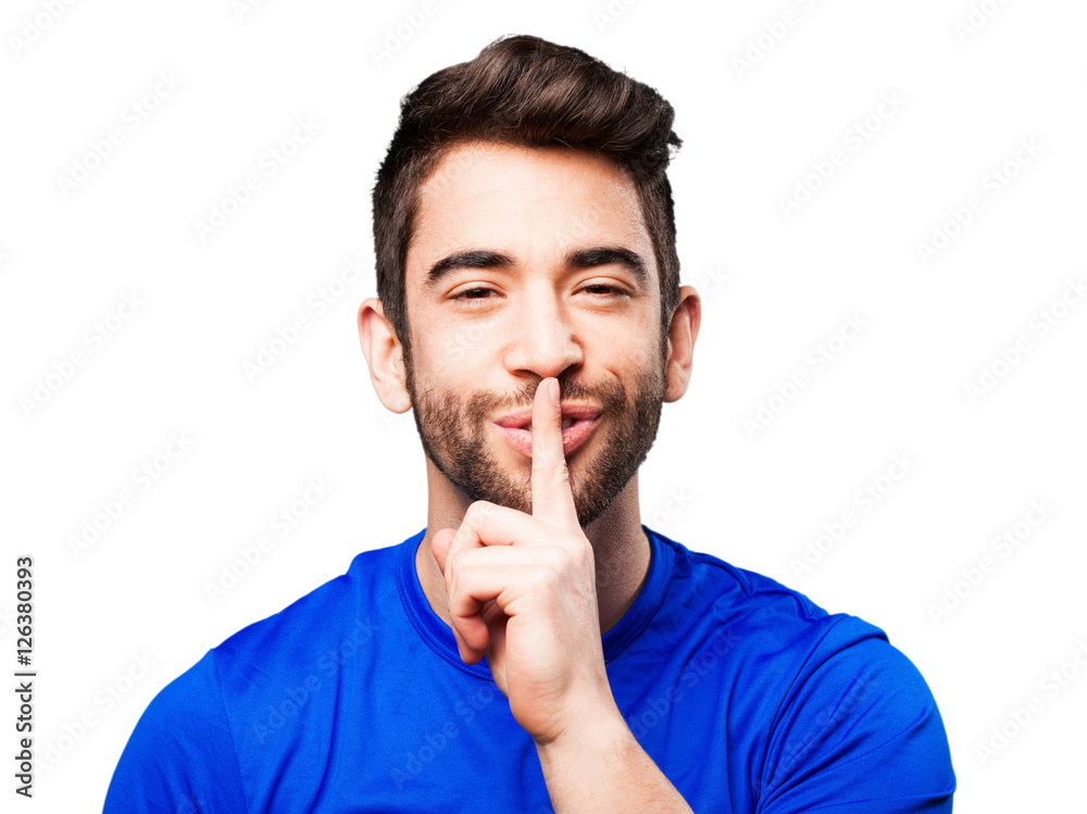 young man doing silence gesture young man doing silence gesture