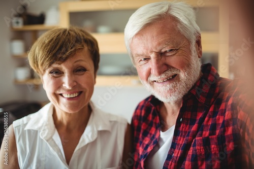 Senior couple smiling in kitchen