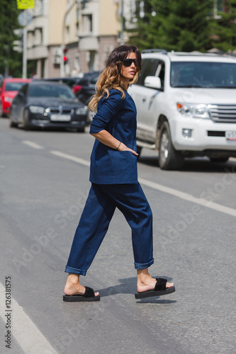 Woman crossing the road city summer