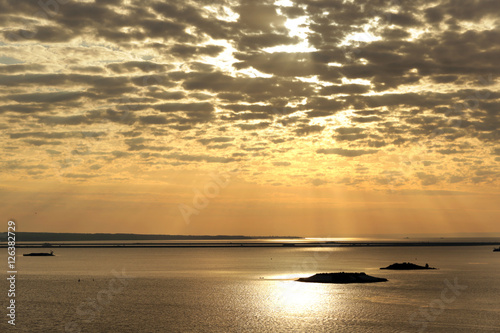 cirrus clouds at sunset over the river