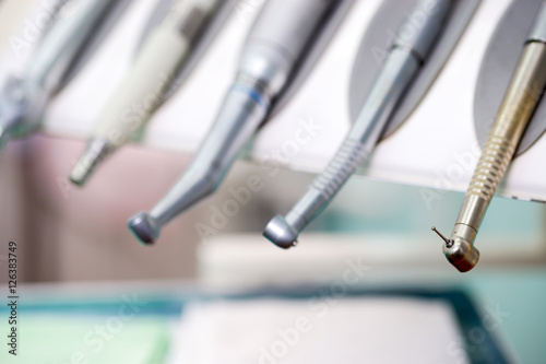 Stomatological instrument in the dentists clinic. Operation, tooth replacement.