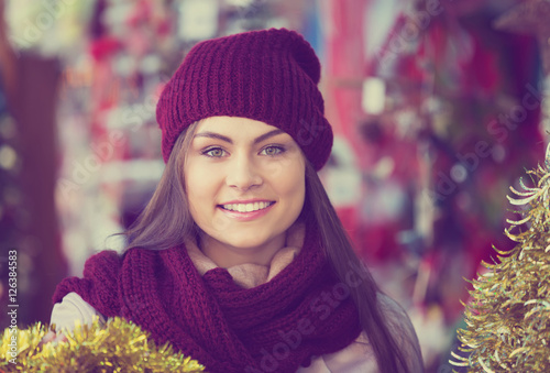 Girl shopping at festive fair photo