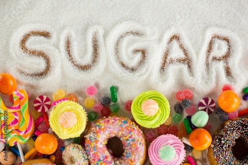 Obraz na plátně Sugar written on sugar powder