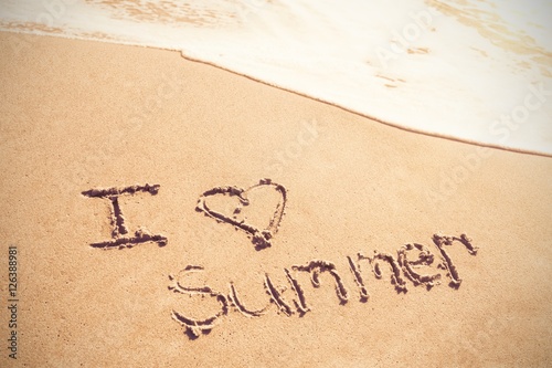 I love summer written on sand