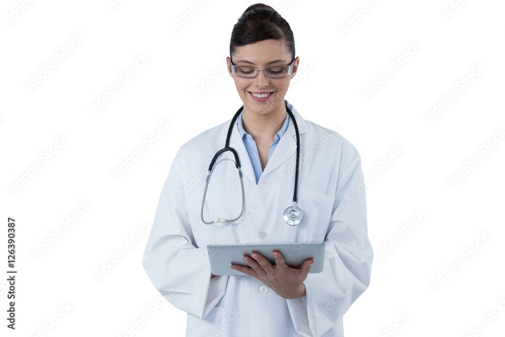Beautiful female doctor using digital tablet