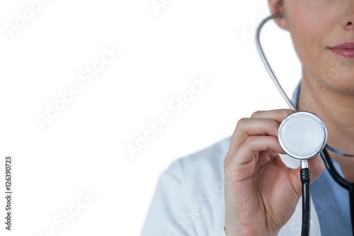 Close-up of female doctor holding stethoscope