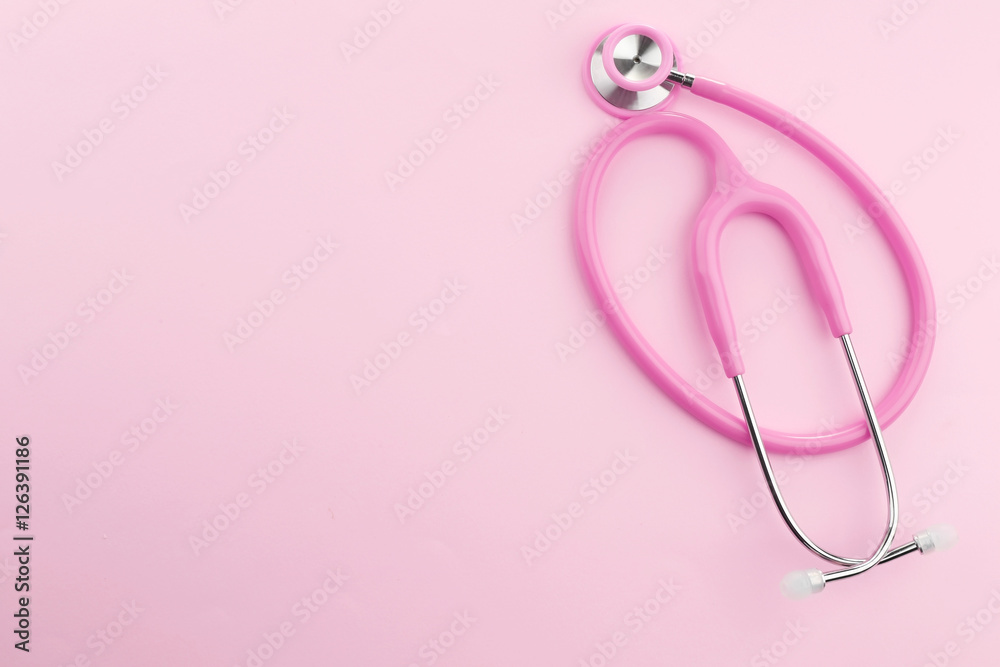 Pink stethoscope on pink background Pink stethoscope on pink background