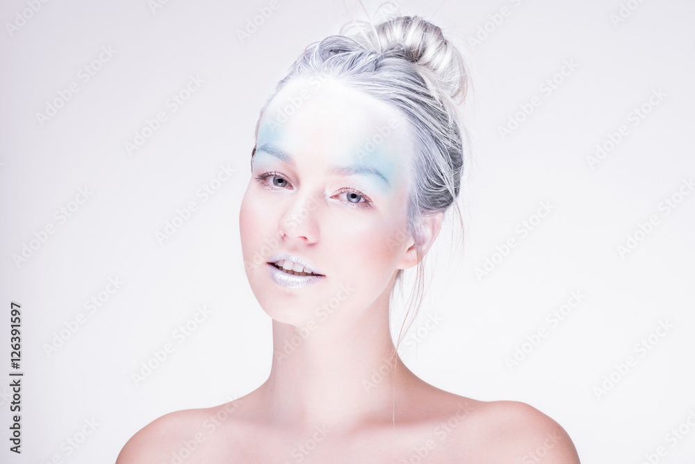 Model in creative image with silver blue artistic make-up Model in creative image with silver blue artistic make-up