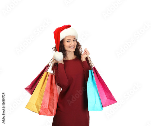 Happy woman holding shopping bags on white background. Christmas shopping concept