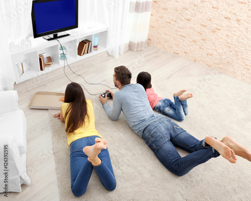 Happy family playing video ...