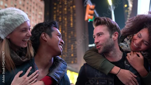 Group of friends having fun at Times Square, NYC