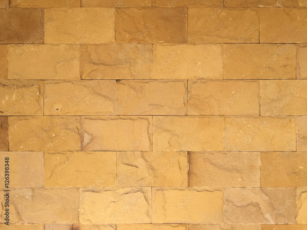 Stone wall texture background natural color. Background of stone wall made with blocks Stone wall texture background natural color. Background of stone wall made with blocks