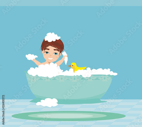baby boy taking bath and playing