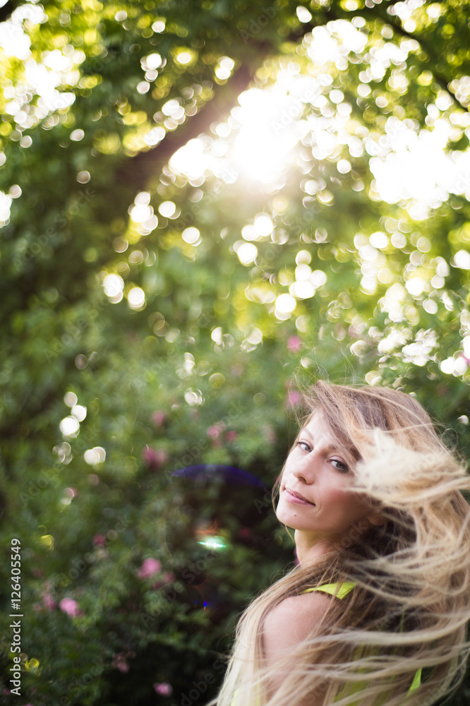 Beautiful young woman with long blonde hair. Sunny summer. Beautiful young woman with long blonde hair. Sunny summer.