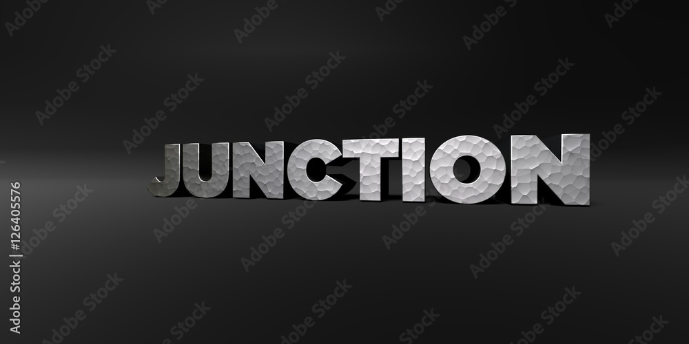 JUNCTION - hammered metal finish text on black studio - 3D rendered royalty free stock photo. This image can be used for an online website banner ad or a print postcard.