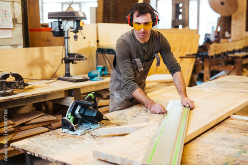 Working at cabinetmaking factory photo