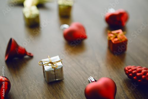 Chrismas gift and vary of decoration on wood table,flare light,selective focus