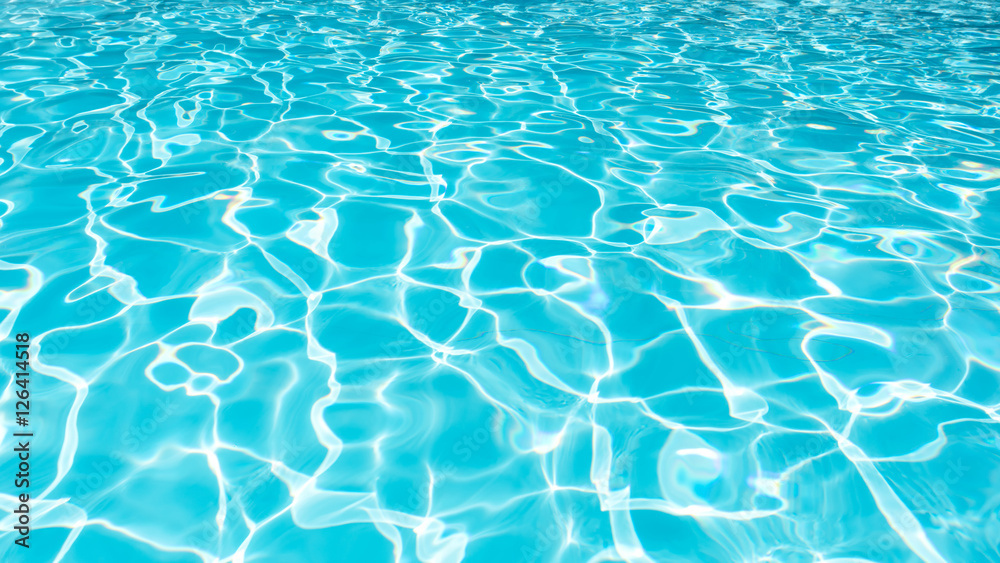 Fototapeta premium Water Surface in swimming pool with sun reflection