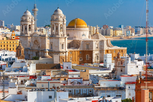 Aerial view of the old city rooftops and Cathedral de Santa Cruz in the morning from tower Tavira in Cadiz, Andalusia, Spain photo