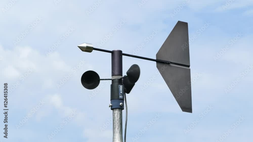 Anemometer measuring wind direction and wind speed at weather station. Anemometer measuring wind direction and wind speed at weather station.