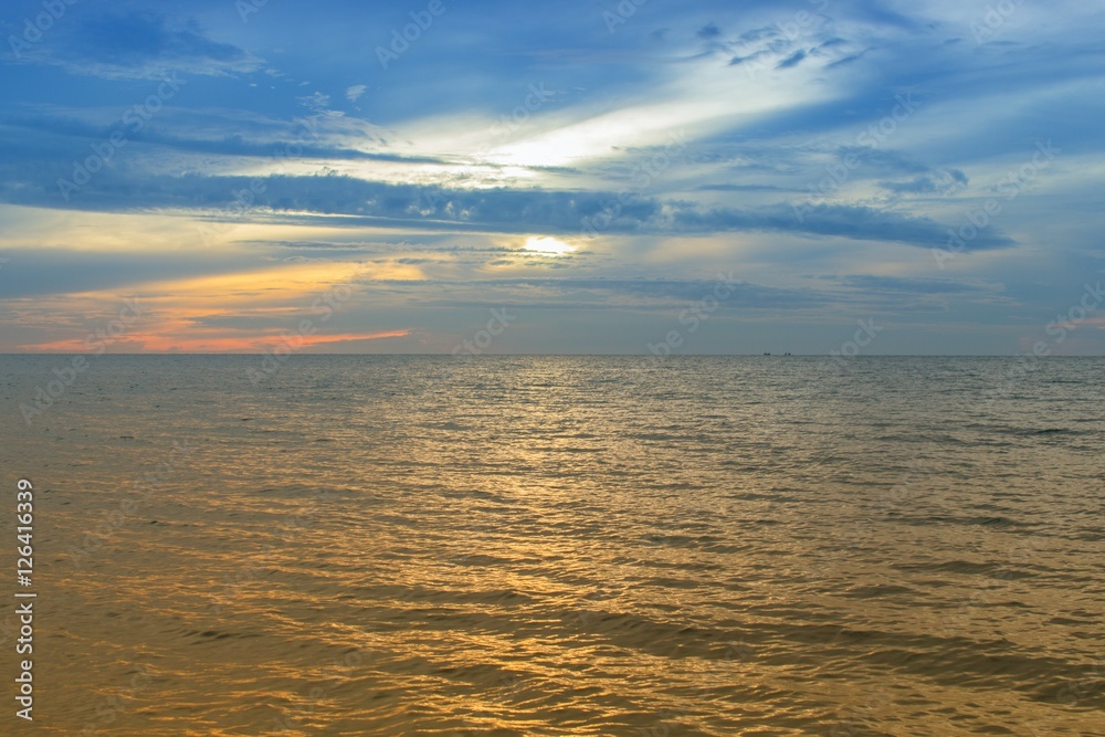 Fototapeta premium Sunrise Sea water and beach and sky. Cold Warm Filter look Colorful