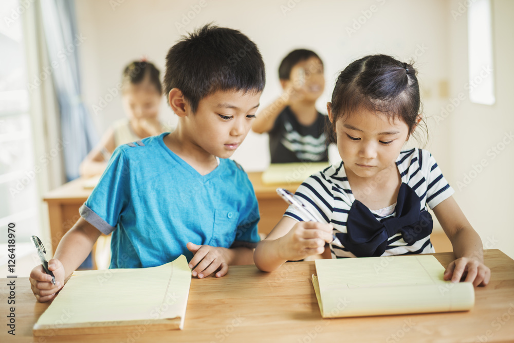 Group of children in classroom, working together Group of children in classroom, working together