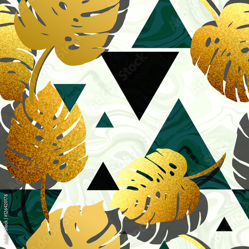 Gold monstera and emerald green triangle shapes seamless pattern. Trendy marble, glittering gold, exotic plants texture.