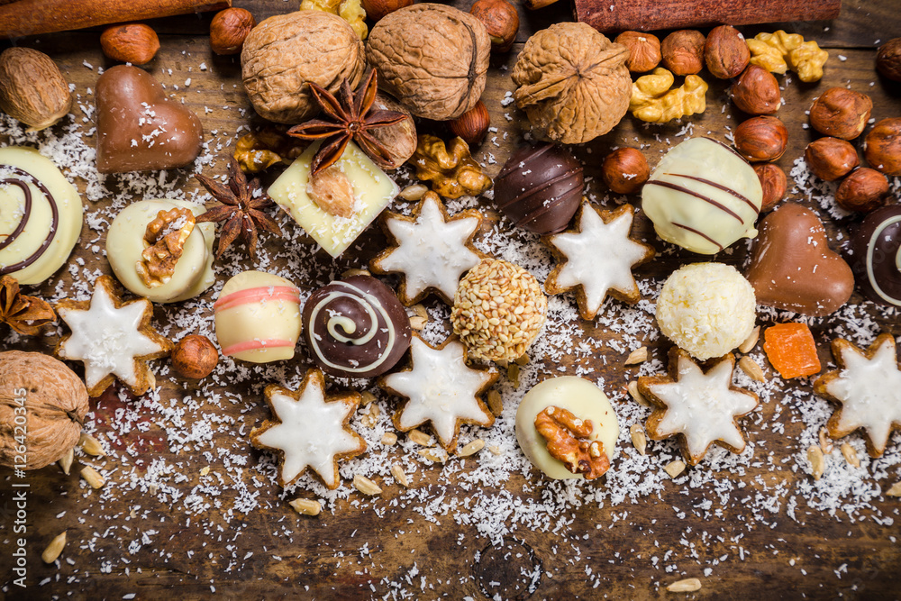 Fototapeta premium dark wooden background with sweets and chocolate