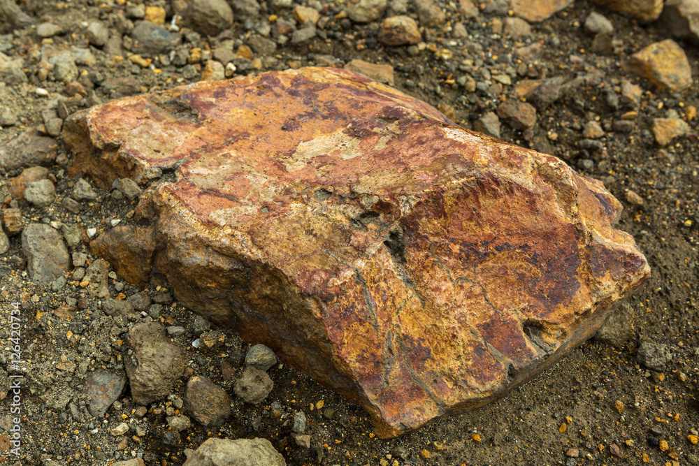 Huge stone on slope of the volcano Mutnovsky. Huge stone on slope of the volcano Mutnovsky.