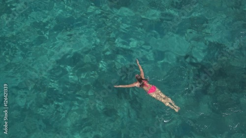 Wallpaper Mural AERIAL: Fit young woman swimming in amazing ocean and watching surroundings Torontodigital.ca