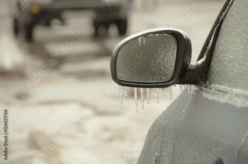 freezing rain ice coated car. photo