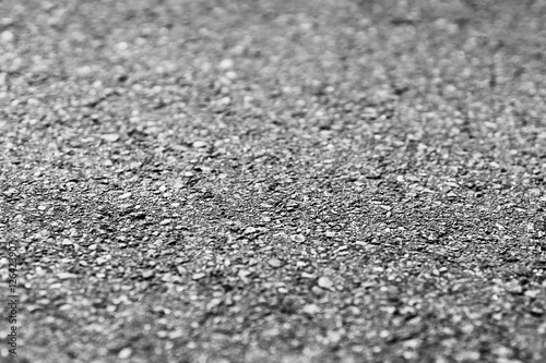 Horizontal black and white ground texture with bokeh background