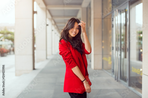 Beautiful young asian woman outdoors photo